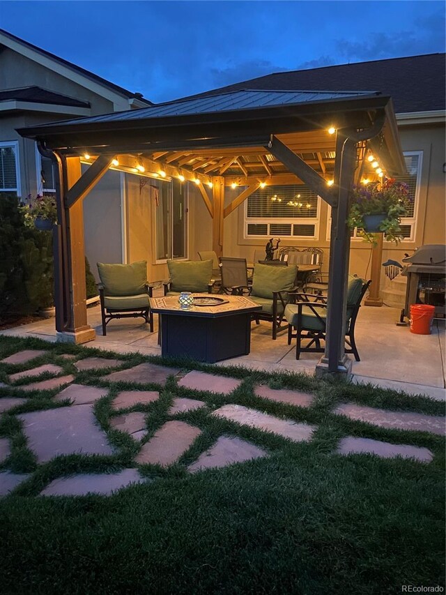 view of patio / terrace featuring an outdoor fire pit and area for grilling