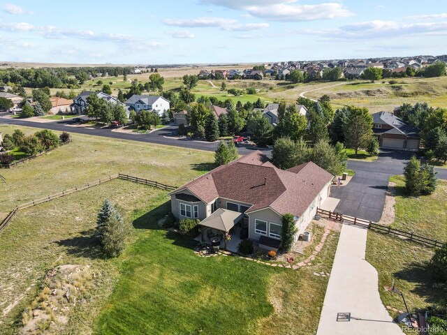 birds eye view of property with a residential view