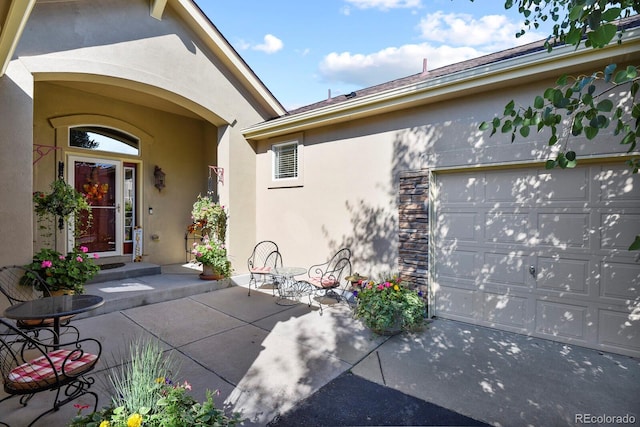 property entrance featuring stucco siding