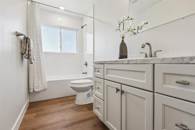 full bathroom with toilet, shower / tub combo, wood-type flooring, and vanity