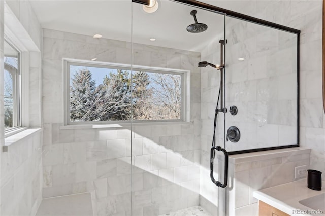 bathroom with vanity and walk in shower