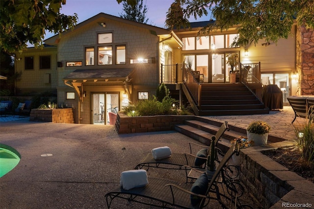 view of front of house with french doors and a patio