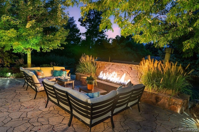 patio terrace at dusk with an outdoor hangout area