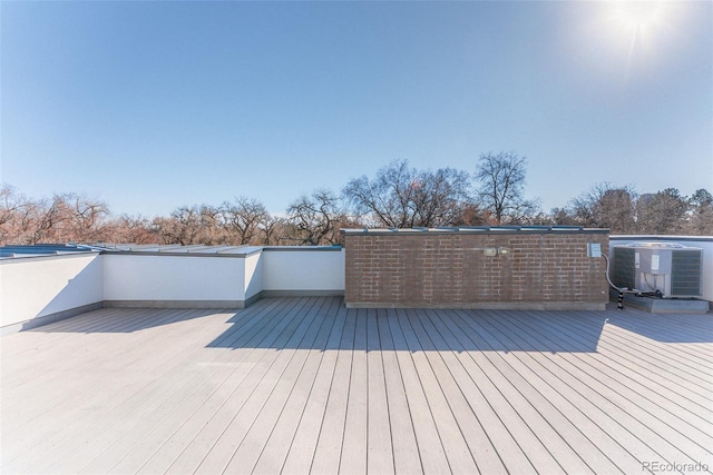 wooden terrace featuring central AC unit