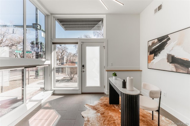 entryway with visible vents and baseboards