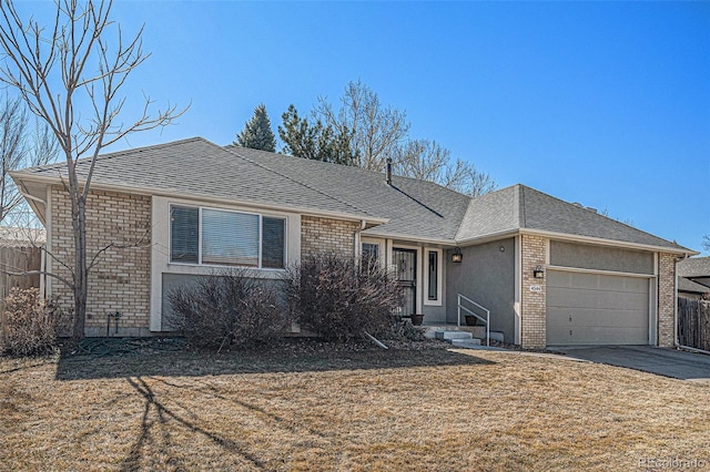 ranch-style house with aphalt driveway, brick siding, an attached garage, and fence