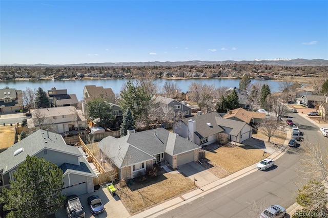 bird's eye view with a residential view and a water view