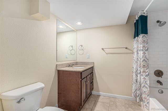 full bathroom with vanity, shower / bathtub combination with curtain, baseboards, tile patterned floors, and toilet