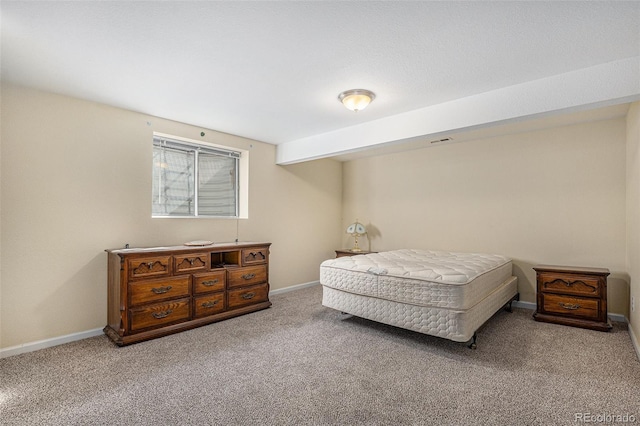 bedroom featuring carpet flooring and baseboards