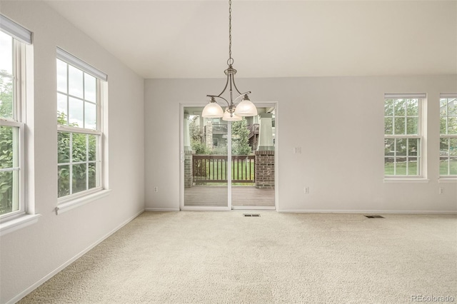 8267 S Sicily Ct, Aurora, CO 80016 - carpeted spare room with a chandelier and baseboards