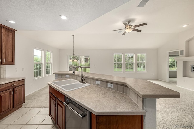 8267 S Sicily Ct, Aurora, CO 80016 - kitchen with stainless steel dishwasher, light carpet, a sink, healthy amount of natural light, and vaulted ceiling