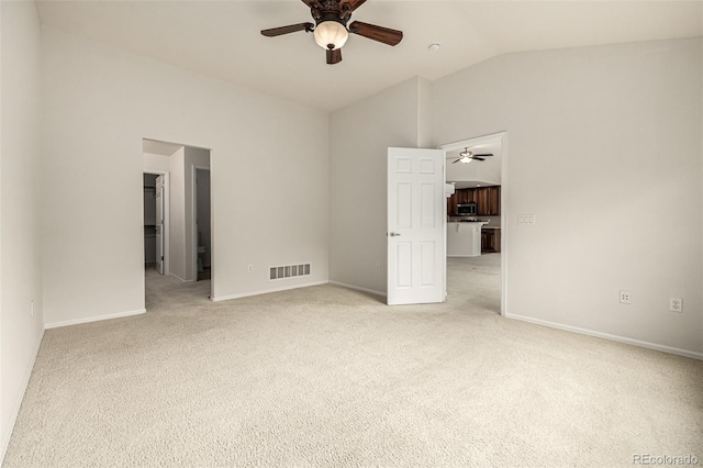 8267 S Sicily Ct, Aurora, CO 80016 - unfurnished bedroom featuring lofted ceiling, light colored carpet, baseboards, and a ceiling fan