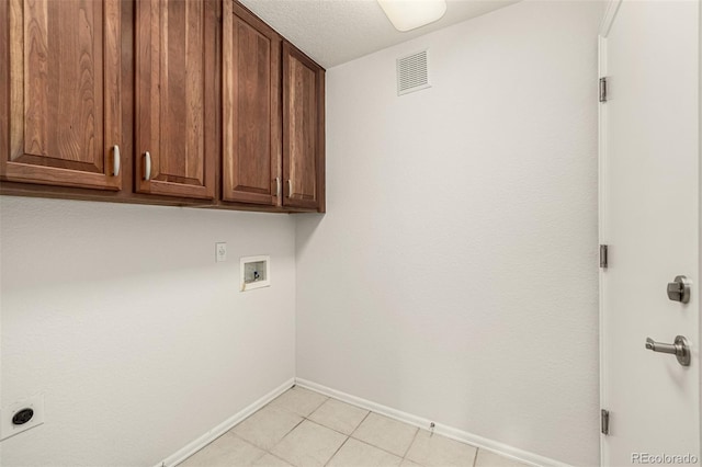 8267 S Sicily Ct, Aurora, CO 80016 - washroom with cabinet space, baseboards, washer hookup, electric dryer hookup, and light tile patterned floors