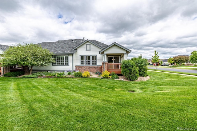 8267 S Sicily Ct, Aurora, CO 80016 - view of front of property with brick siding and a front yard