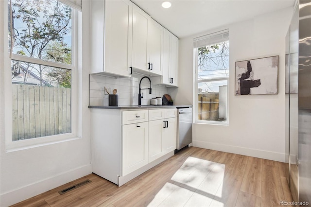 bar with dishwasher, baseboards, light wood-style floors, backsplash, and recessed lighting