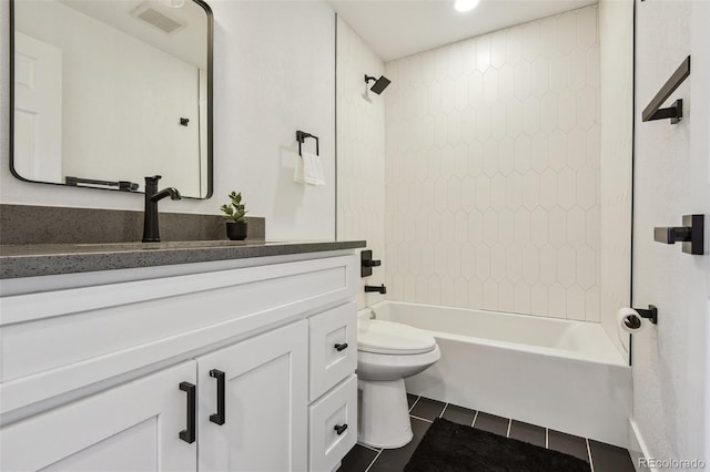 full bath with tile patterned floors, vanity, toilet, and shower / tub combination