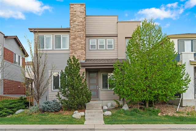 3384 Cranston Cir, Highlands Ranch, CO 80126 - view of front of property featuring a chimney