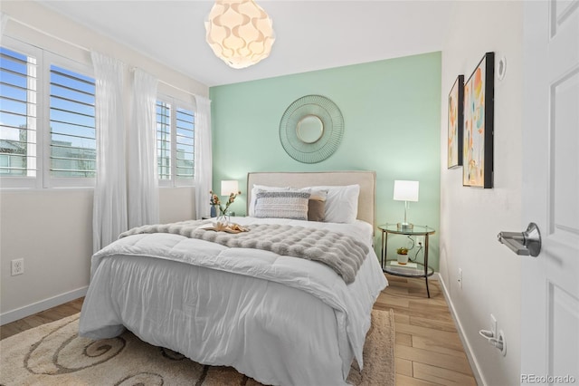 3384 Cranston Cir, Highlands Ranch, CO 80126 - bedroom featuring light wood-type flooring and baseboards