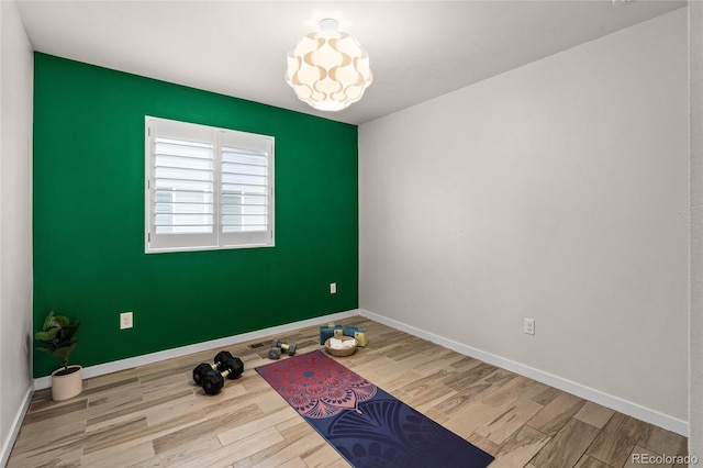 3384 Cranston Cir, Highlands Ranch, CO 80126 - workout area featuring wood finished floors and baseboards
