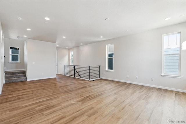 unfurnished room with light hardwood / wood-style flooring