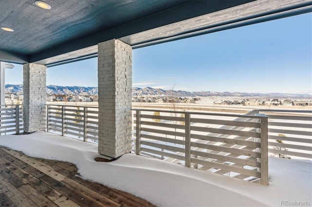 view of patio / terrace with a mountain view and a balcony