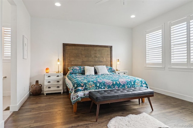 bedroom featuring wood finished floors, baseboards, and recessed lighting