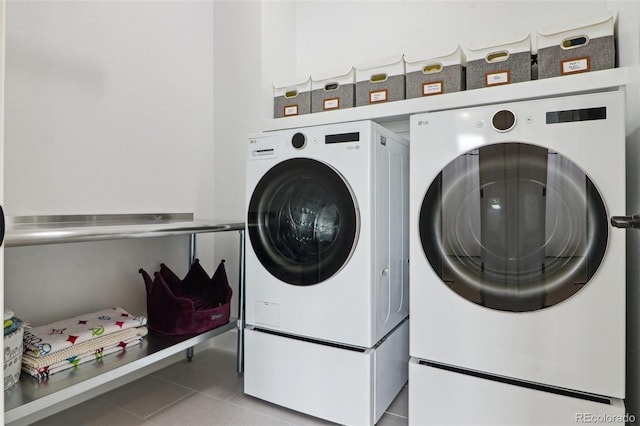 washroom featuring laundry area, independent washer and dryer, and tile patterned flooring
