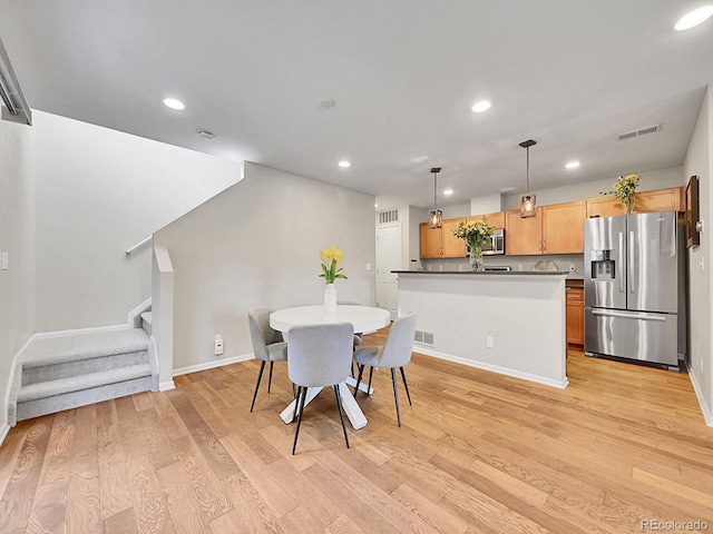 dining area featuring light hardwood / wood-style floors