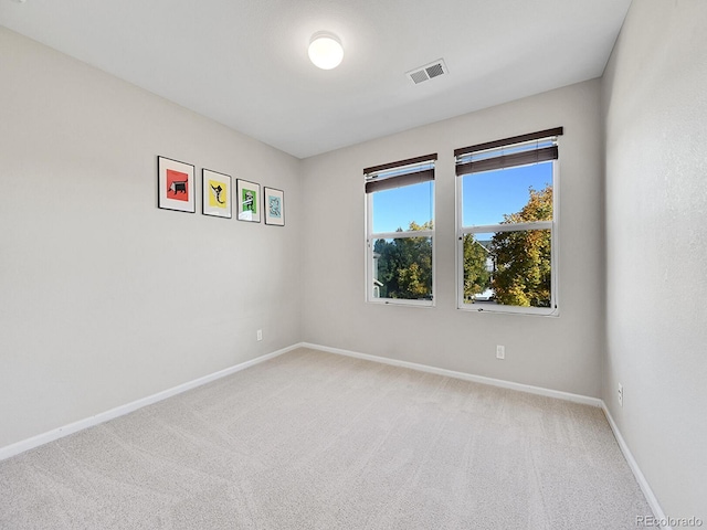 unfurnished room featuring carpet