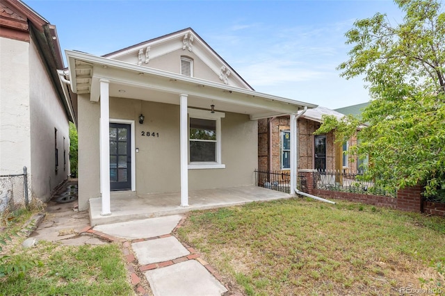 2841 Stout St, Denver, CO 80205 - view of front facade featuring stucco siding and a porch