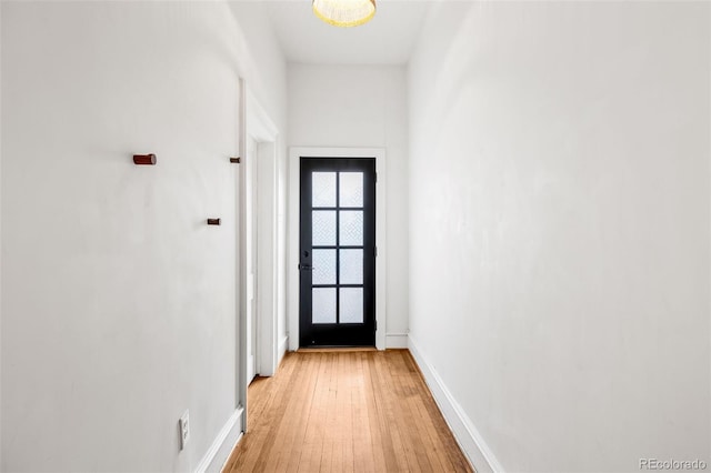 2841 Stout St, Denver, CO 80205 - doorway featuring light wood-type flooring and baseboards