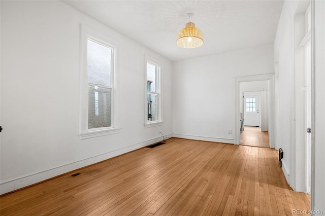 2841 Stout St, Denver, CO 80205 - spare room featuring light wood-type flooring and baseboards