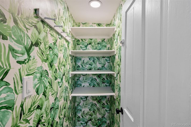2841 Stout St, Denver, CO 80205 - staircase featuring wallpapered walls