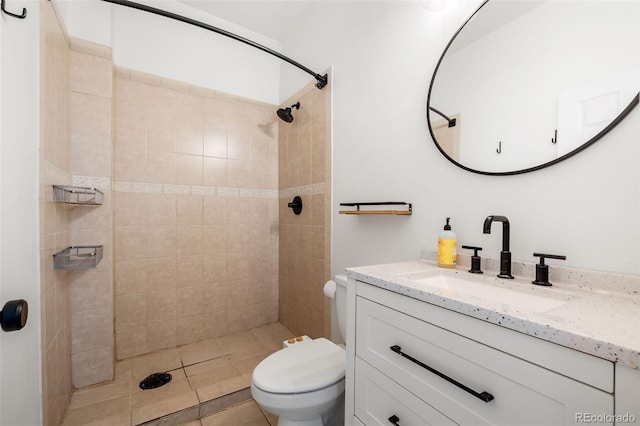 2841 Stout St, Denver, CO 80205 - bathroom with toilet, vanity, a tile shower, and tile patterned floors