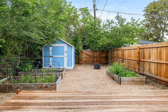 2841 Stout St, Denver, CO 80205 - wooden terrace with a vegetable garden and a fenced backyard