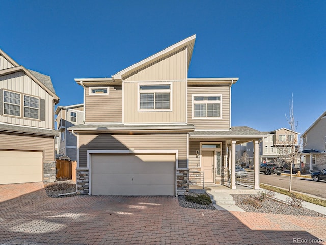 townhome / multi-family property featuring a garage