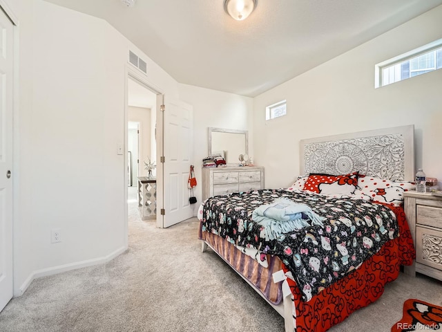 bedroom with light carpet