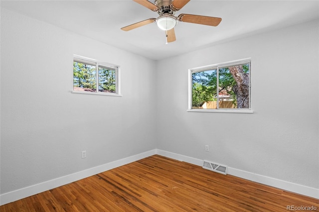 8580 Wiley Cir, Westminster, CO 80031 - unfurnished room featuring healthy amount of natural light, wood finished floors, and ceiling fan