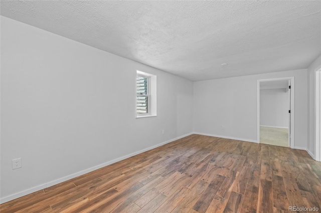 8580 Wiley Cir, Westminster, CO 80031 - unfurnished room featuring wood-type flooring and a textured ceiling