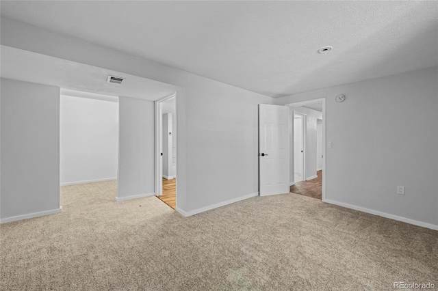 8580 Wiley Cir, Westminster, CO 80031 - unfurnished room with carpet, a smoke detector, and a textured ceiling