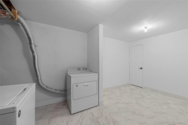 8580 Wiley Cir, Westminster, CO 80031 - laundry room featuring washer and dryer and a textured ceiling