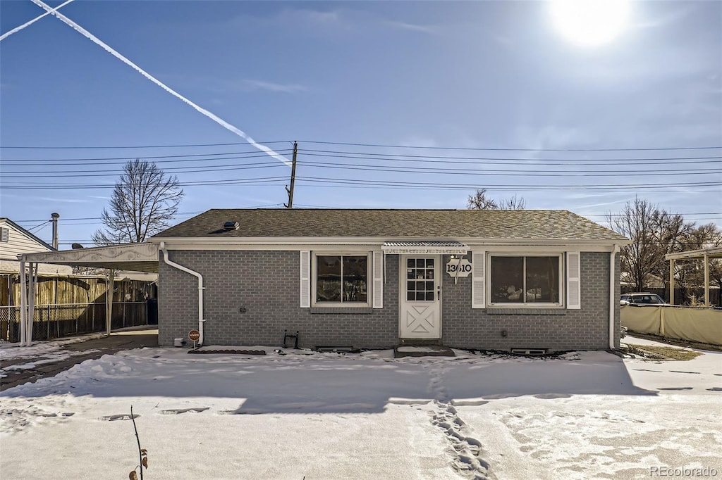 view of front of property featuring a carport