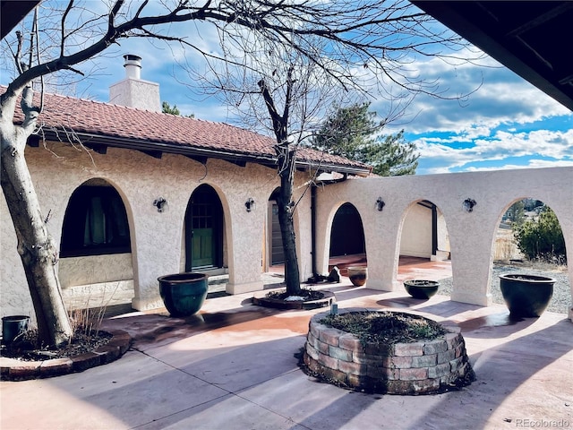 view of patio / terrace with a fire pit