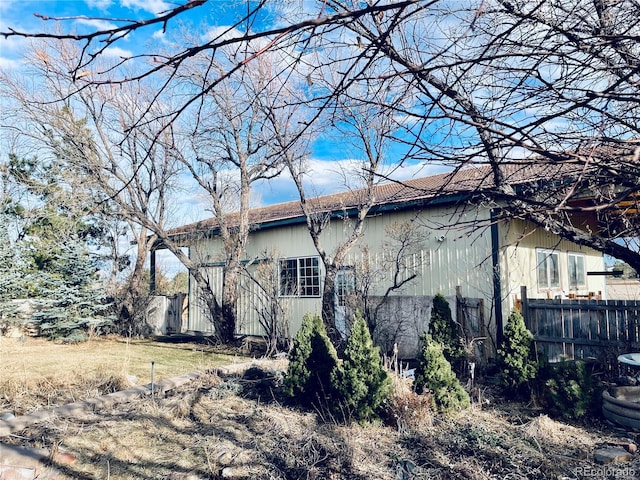 view of property exterior featuring fence