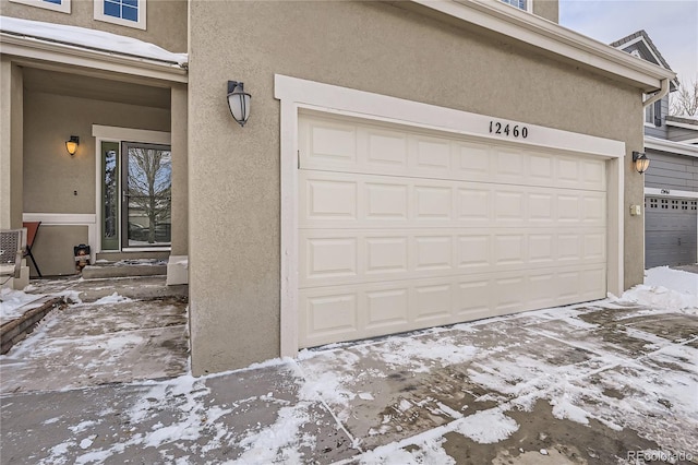 view of snow covered garage