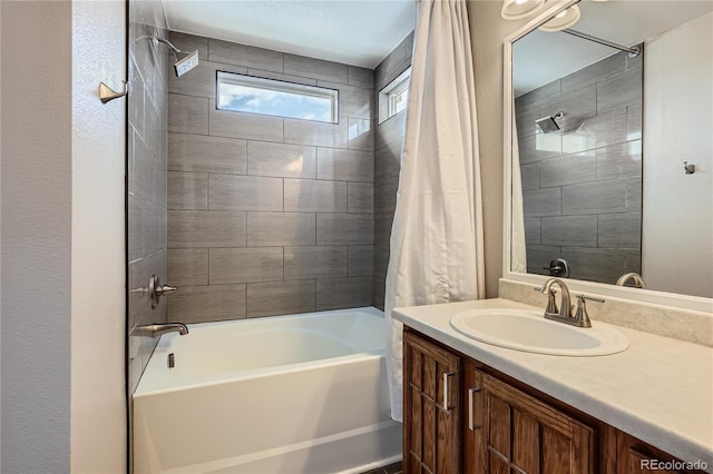 bathroom featuring shower / bath combo and vanity