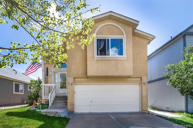 4987 Fabray Ln, Colorado Springs, CO 80922 - view of front of property featuring an attached garage, stucco siding, and concrete driveway