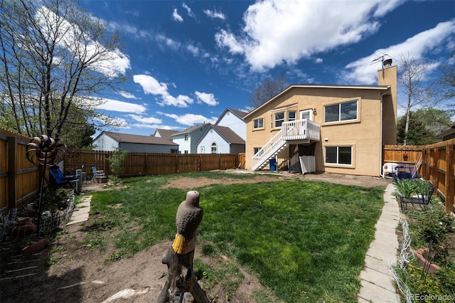 4987 Fabray Ln, Colorado Springs, CO 80922 - rear view of house with stairway, stucco siding, and a chimney