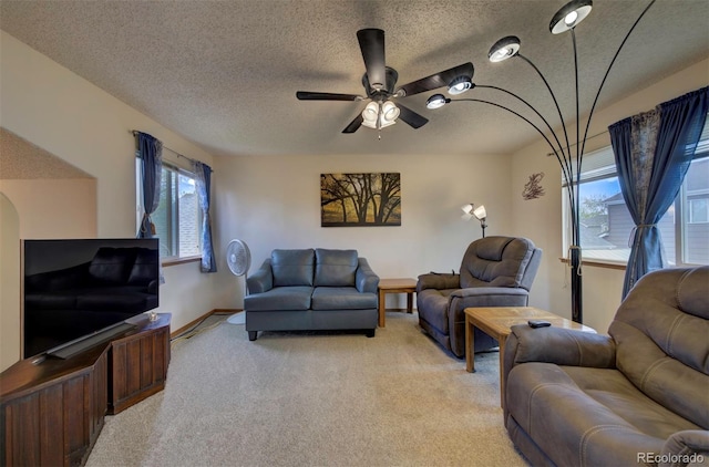 4987 Fabray Ln, Colorado Springs, CO 80922 - living room with light colored carpet, a textured ceiling, ceiling fan, and baseboards
