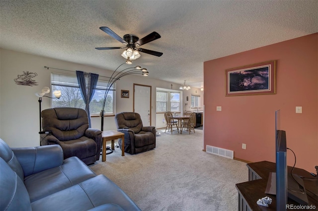 4987 Fabray Ln, Colorado Springs, CO 80922 - living area with ceiling fan, a chandelier, a textured ceiling, and carpet floors